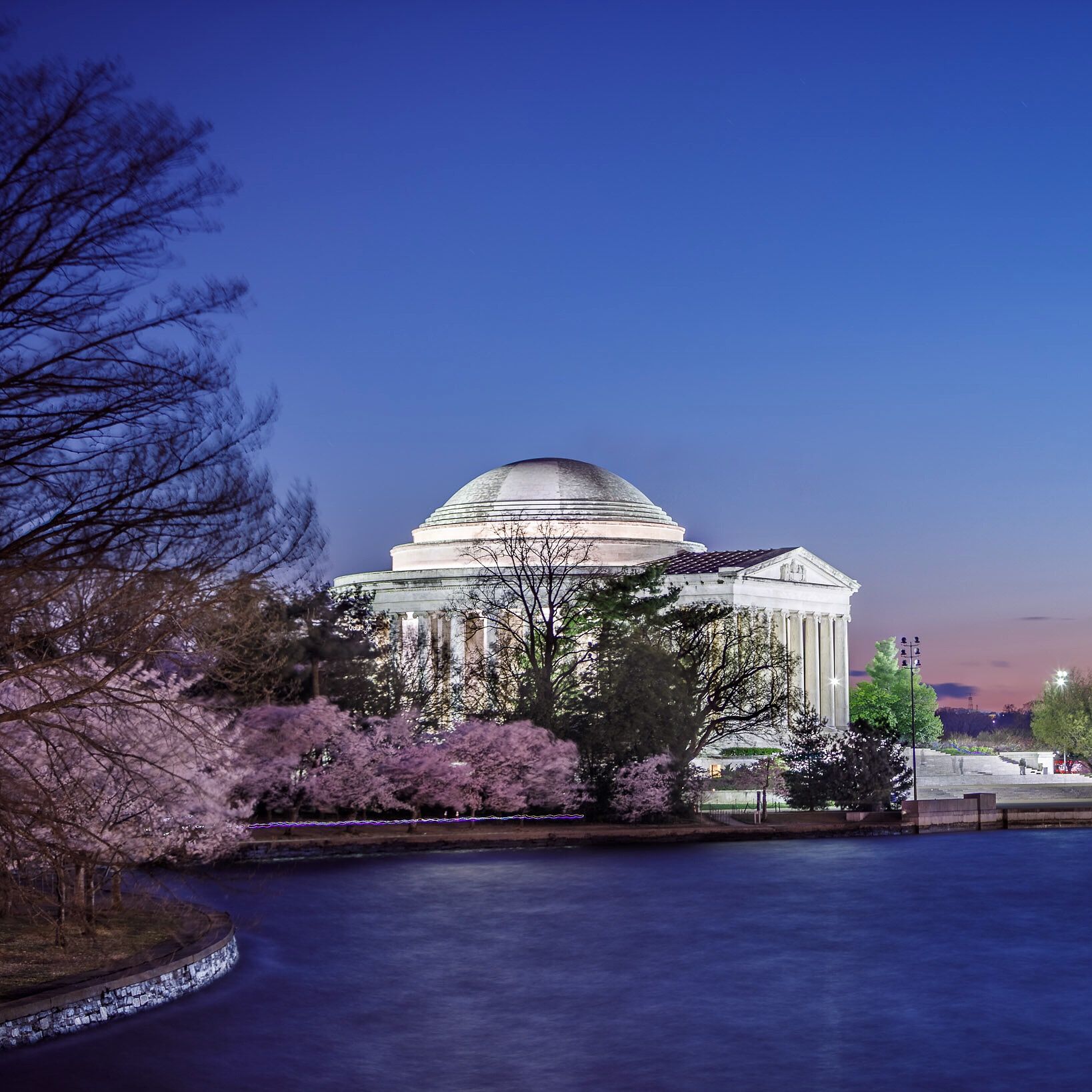 Jefferson Memorial illuminated beside the Tidal Basin