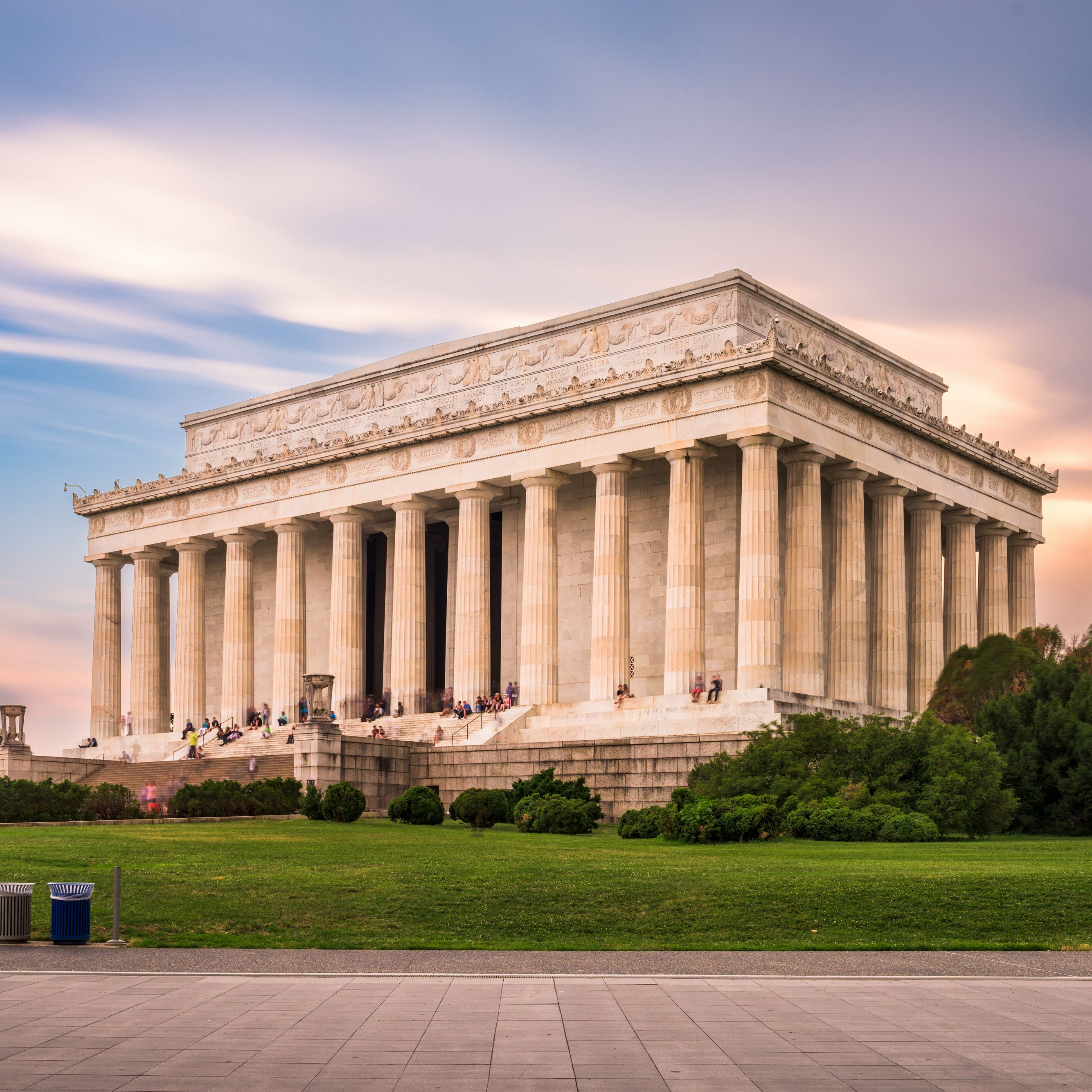Lincoln Memorial at sunset with visitors on the steps