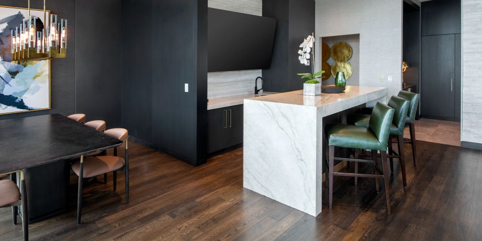 Presidential suite kitchen with marble waterfall island.