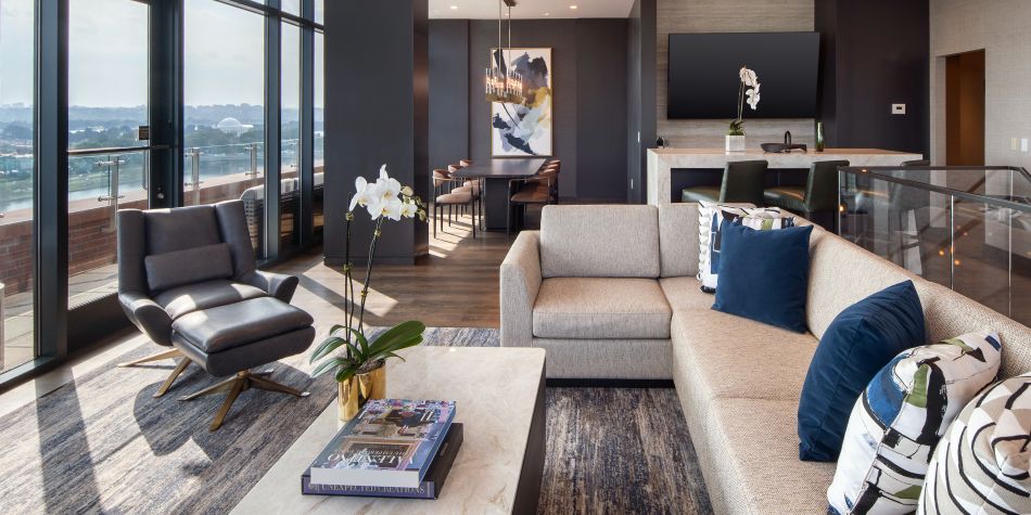 Presidential suite living area open to dining and kitchen.