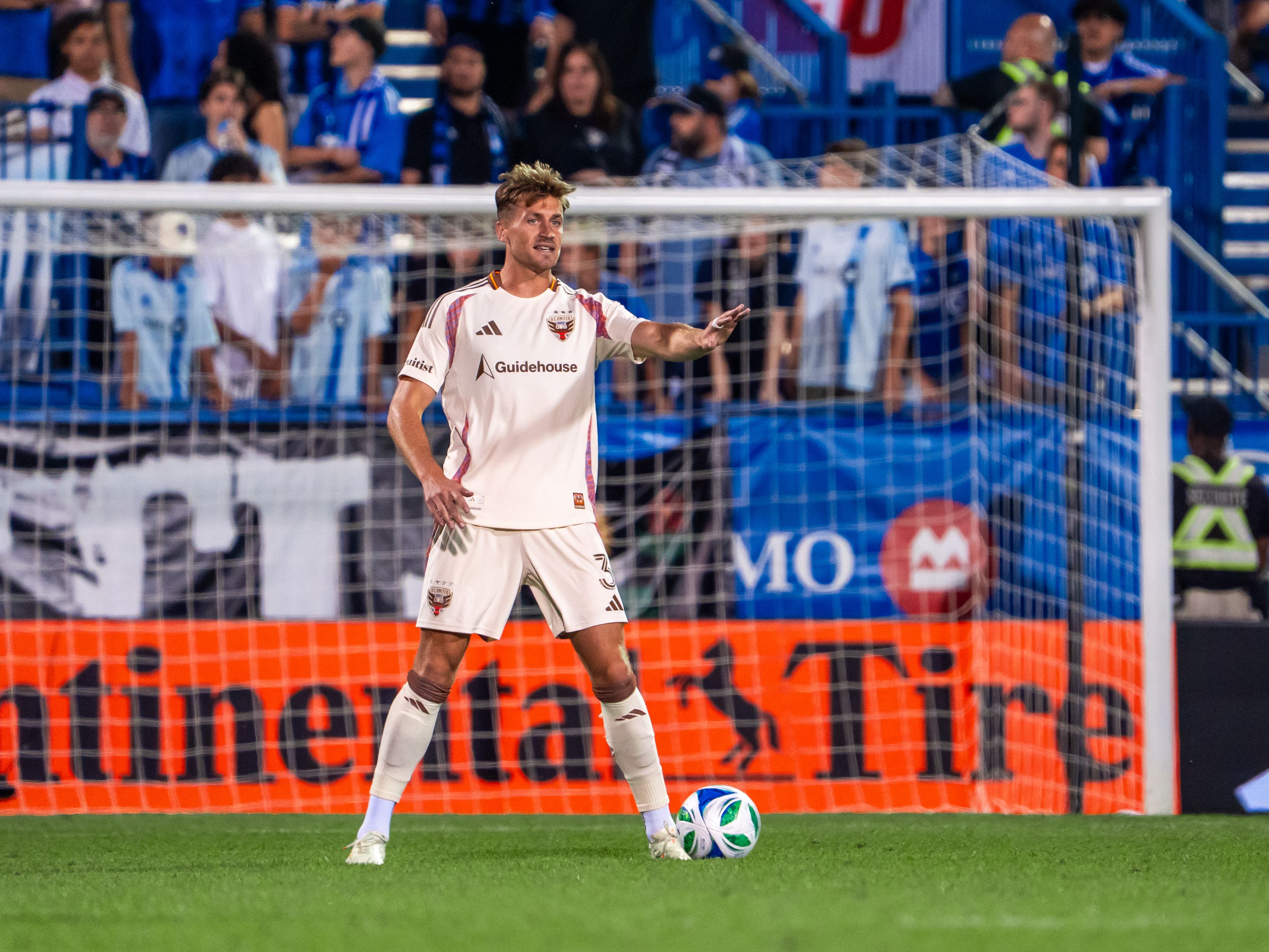 DC United player preparing to take a free kick near the goal at Audi Field.
