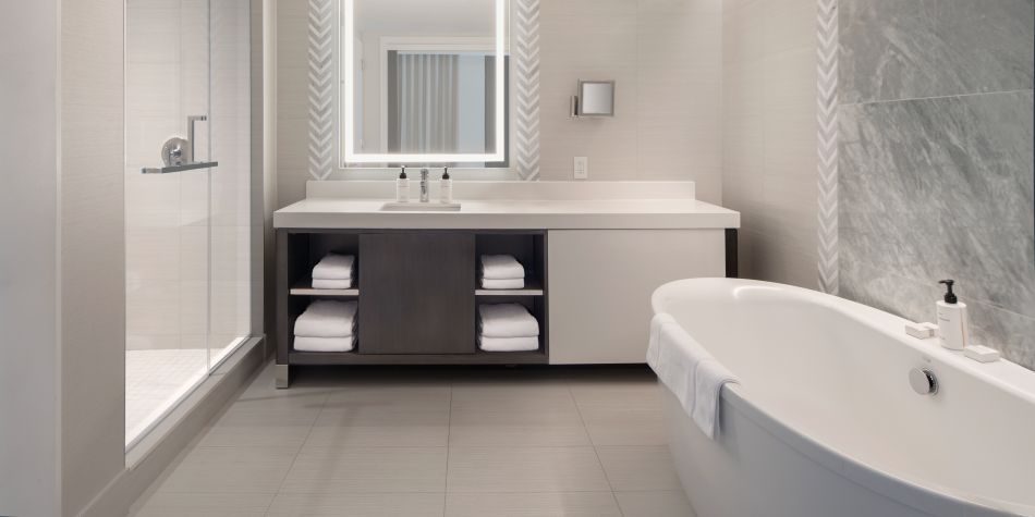 Suite bathroom with shower, vanity and soaking tub.