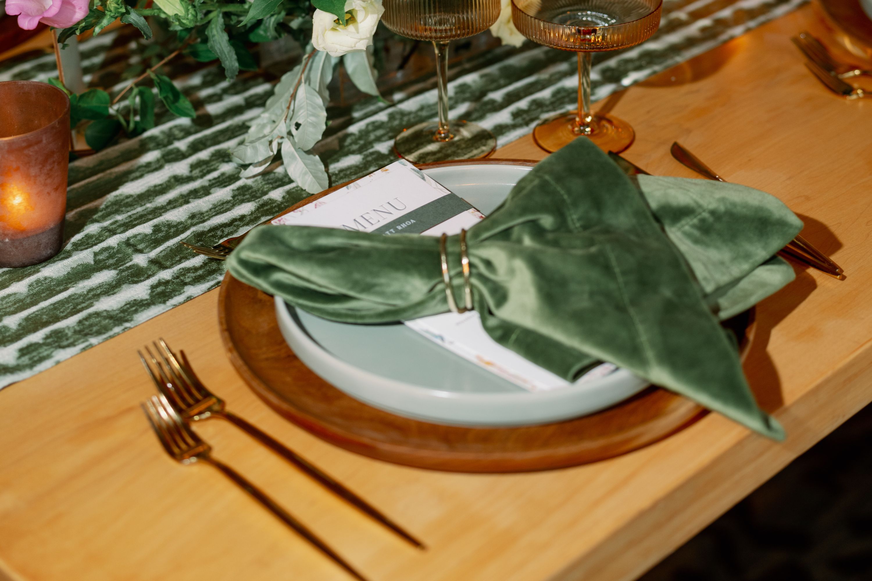 Table setting with green and gold accents.