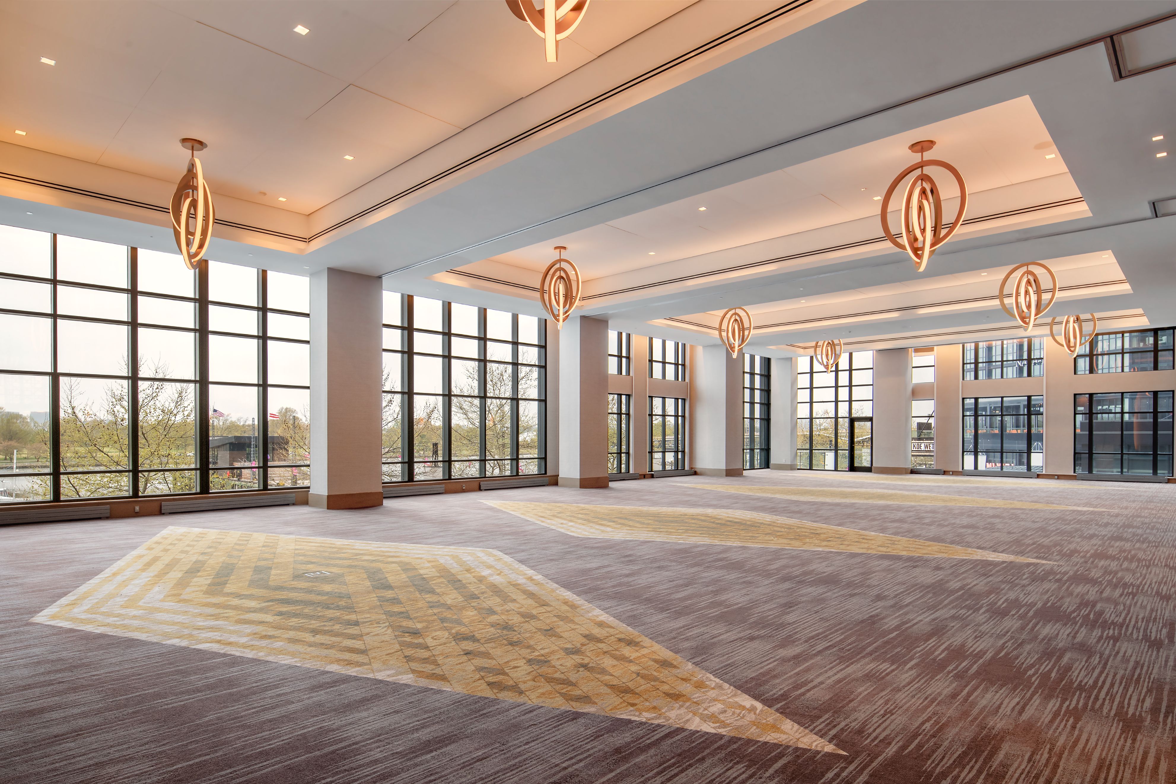 Waterside Ballroom, featuring beautiful light fixtures and natural light.