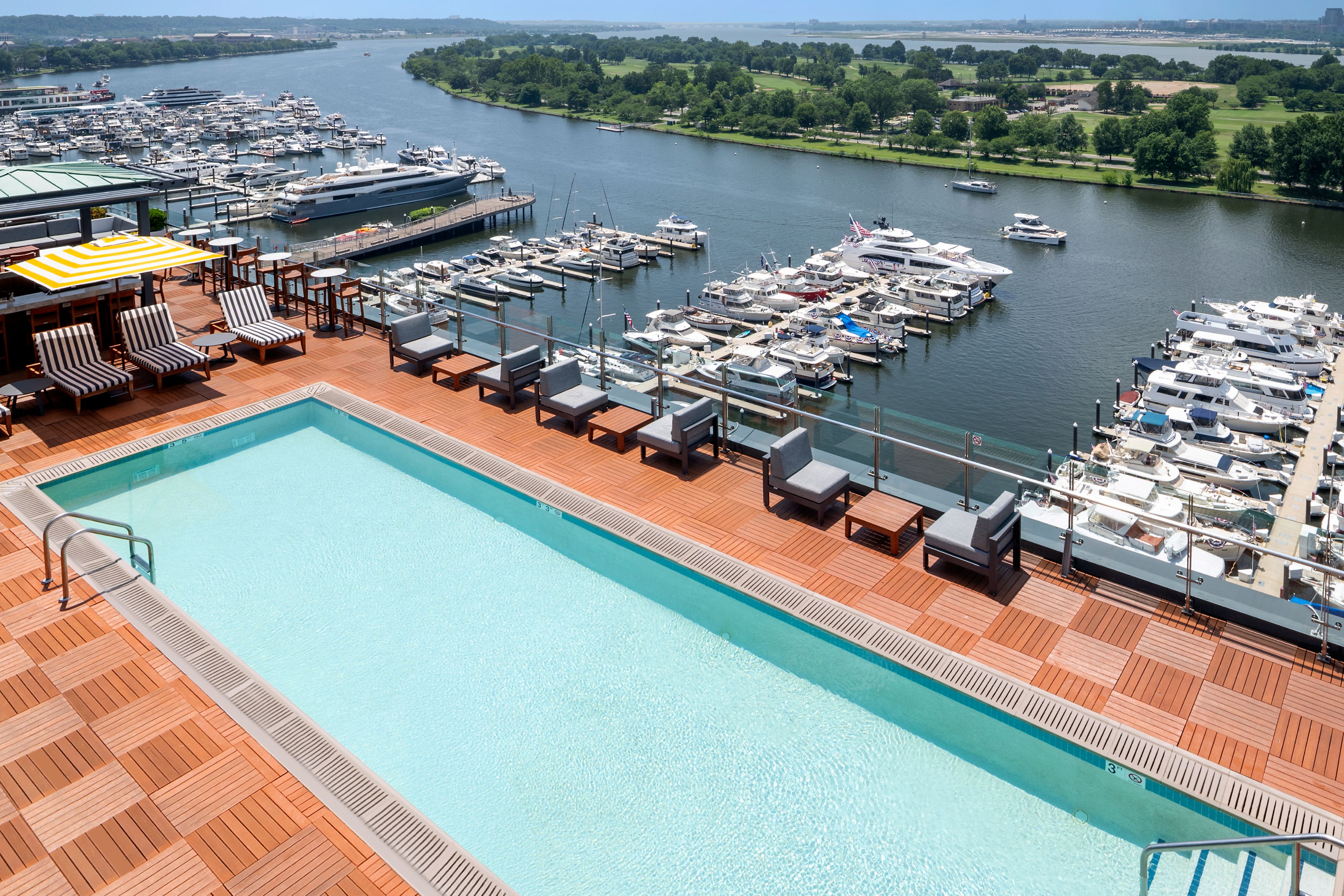Rooftop pool at InterContinental Washington D.C. - The Wharf overlooking the marina, luxury yachts, and the Washington Channel,.