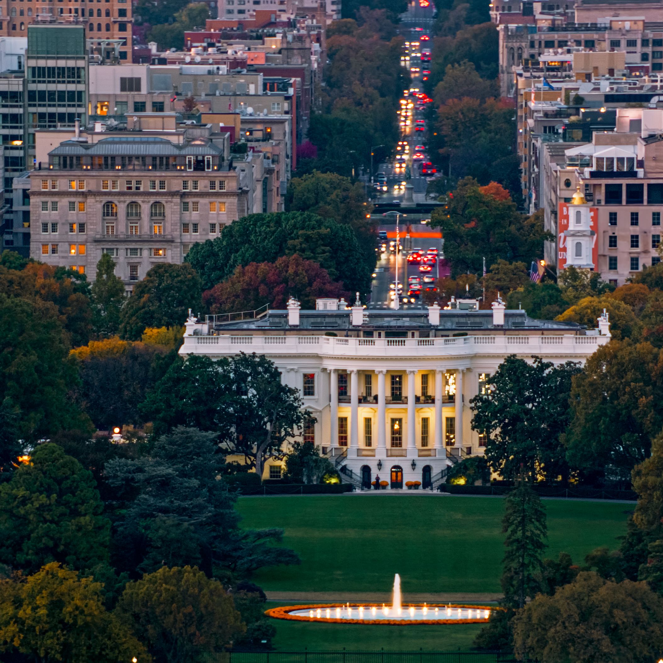 The White House framed by Washington, D.C. at dusk