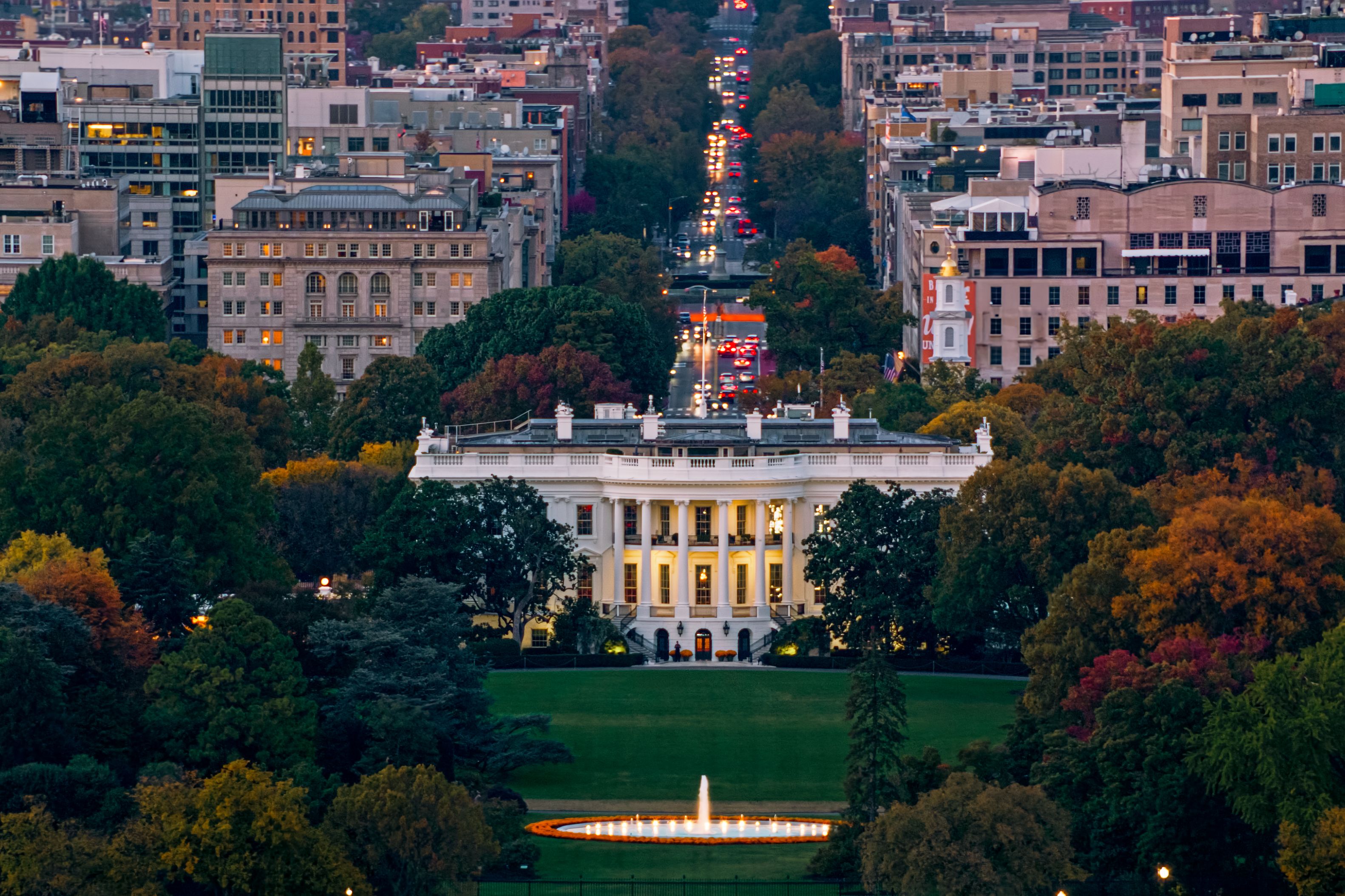 The White House framed by Washington, D.C. at dusk