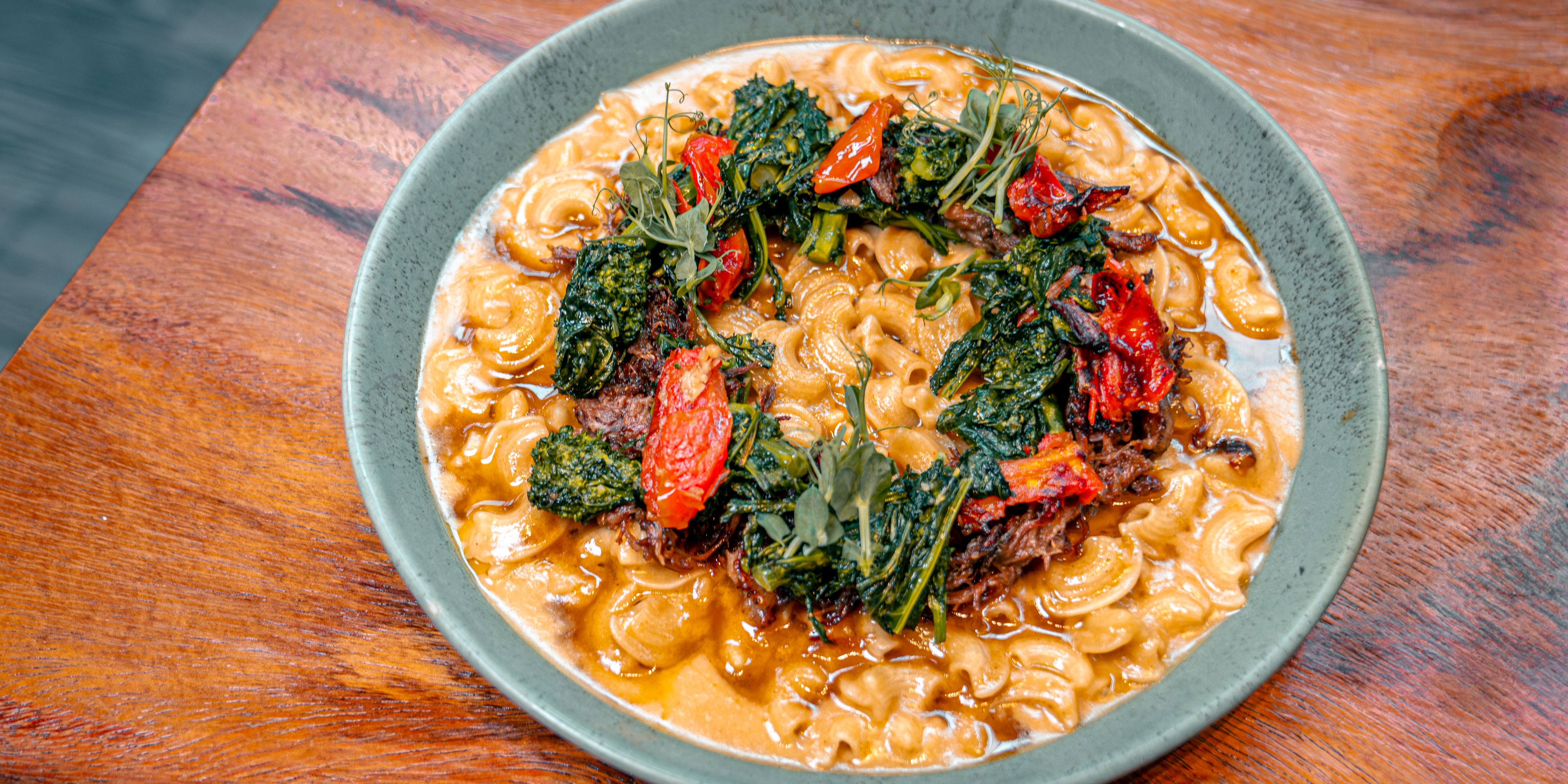 Cresto di Gallo pasta with crispy oxtail and roasted tomato.