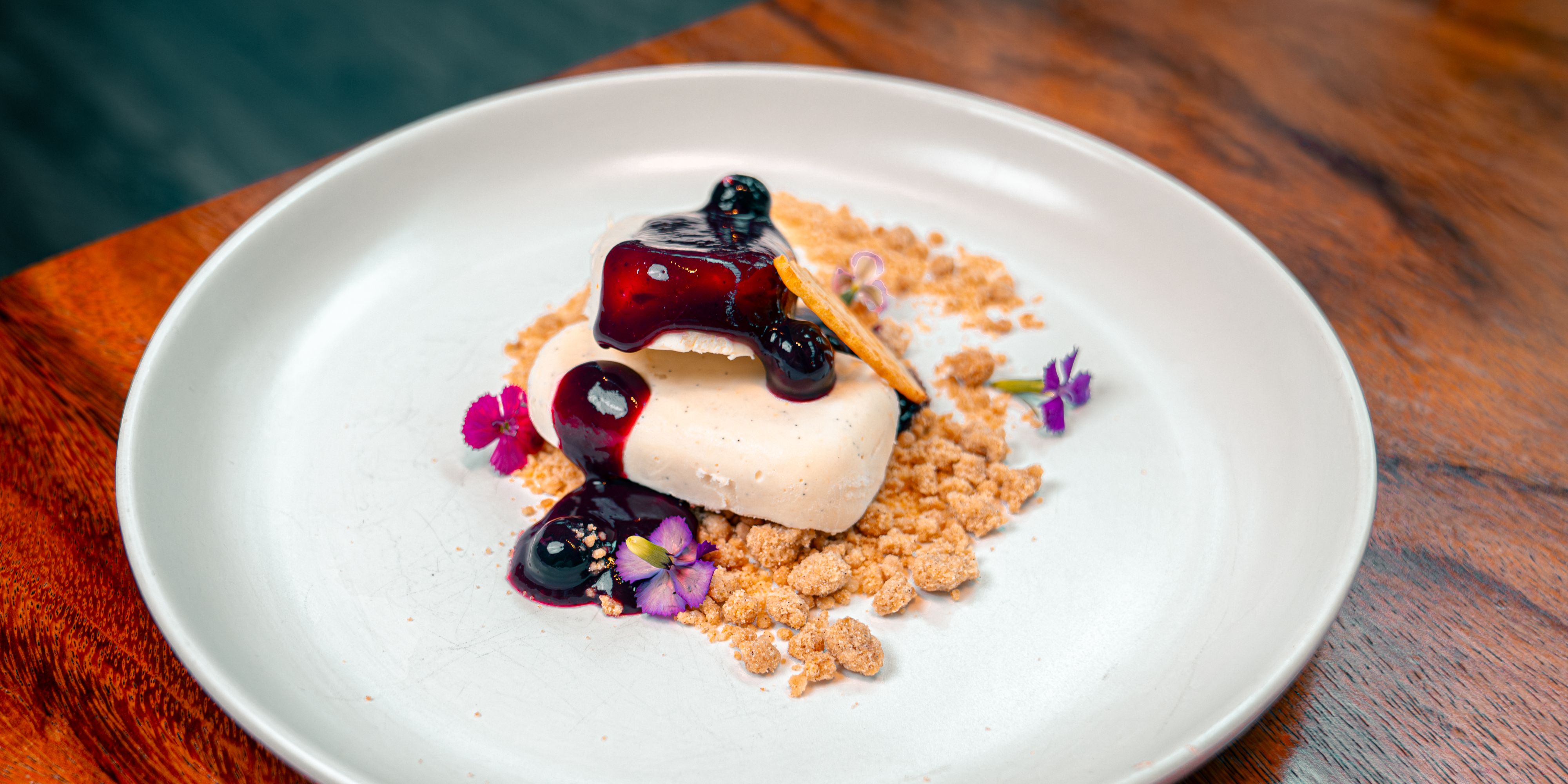 Icebox cheesecake with blueberry compote and honey tuile.