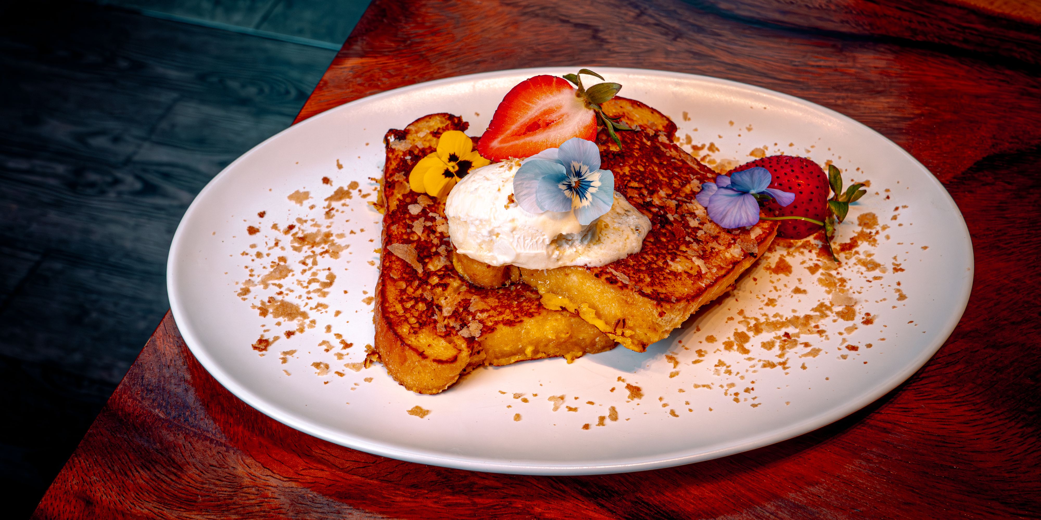 Milk bread French toast with brûléed custard and cream.