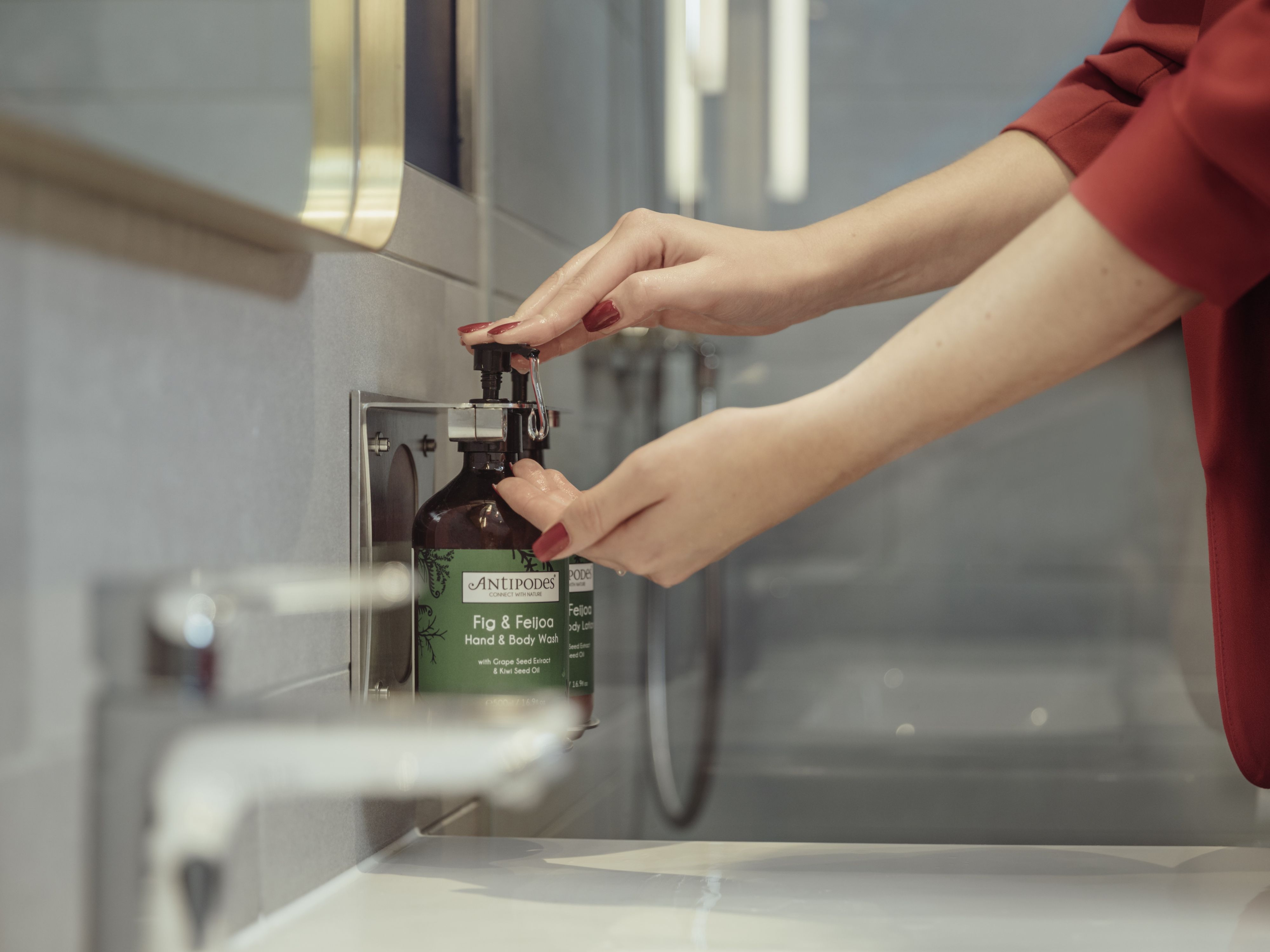Guest using soap dispensers