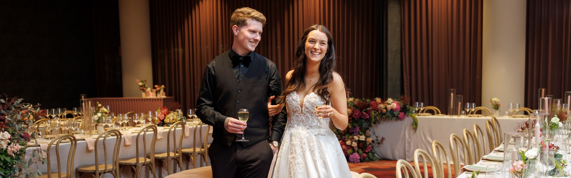 Wedding couple's hands displaying their rings and bouquet.