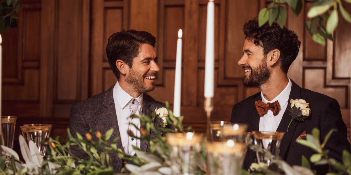 Couple celebrating their wedding day at catered table