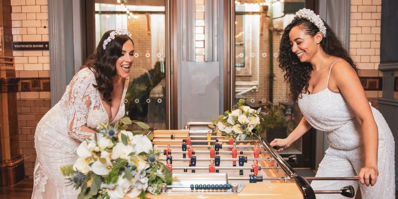 Couple celebrating their wedding day at foosball table