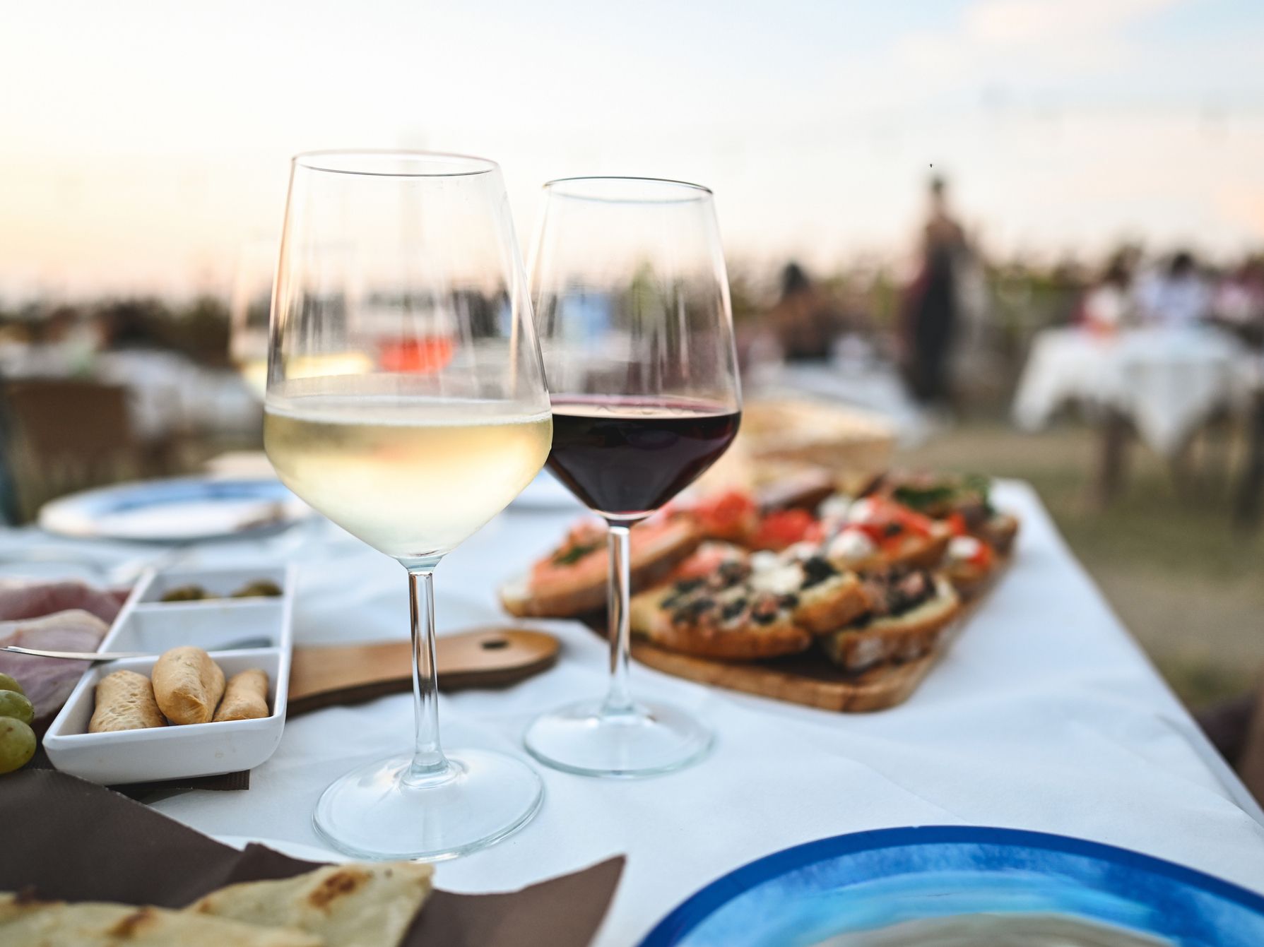 Wine display on a table with food. 