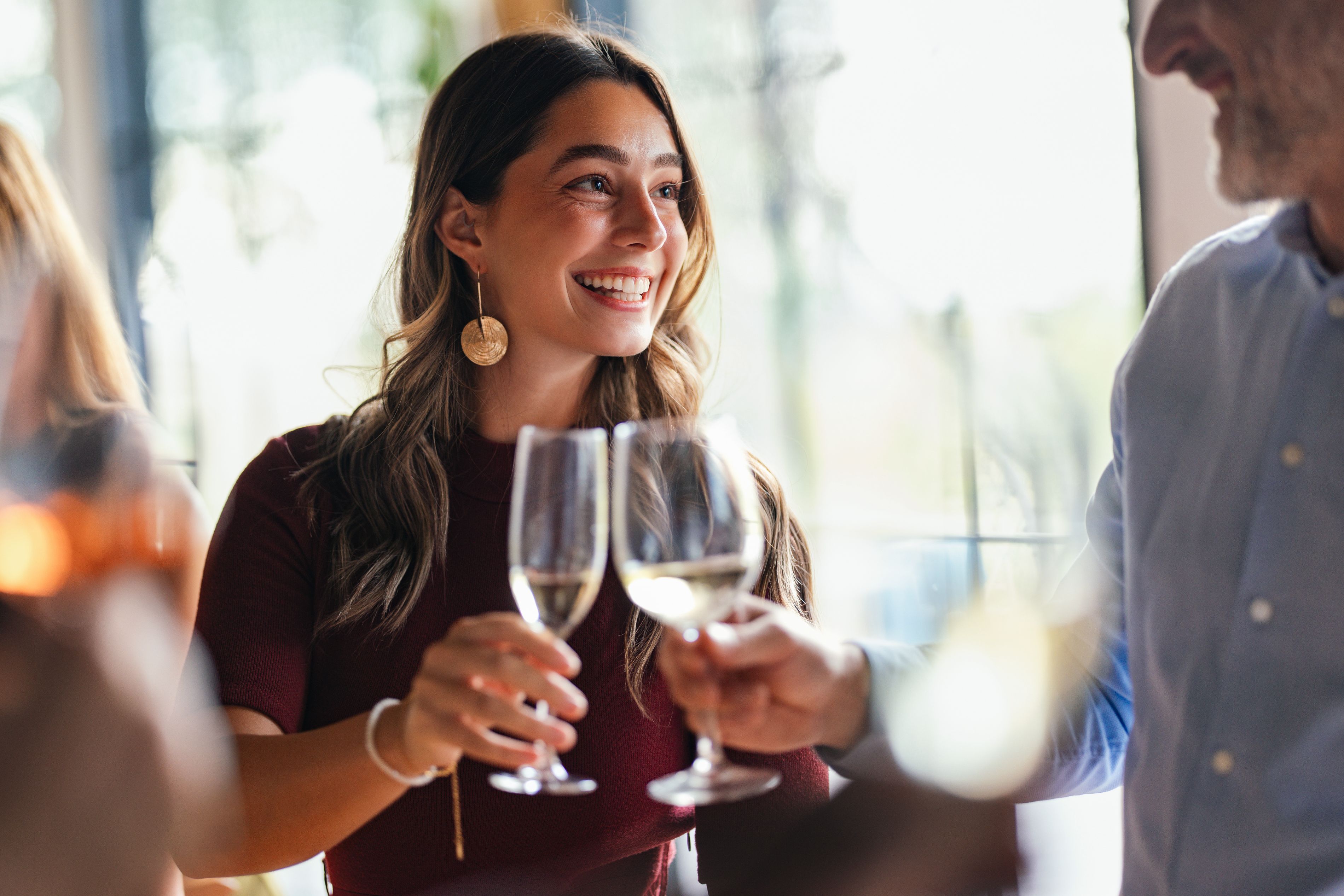 Guests raising glasses during a restaurant gathering