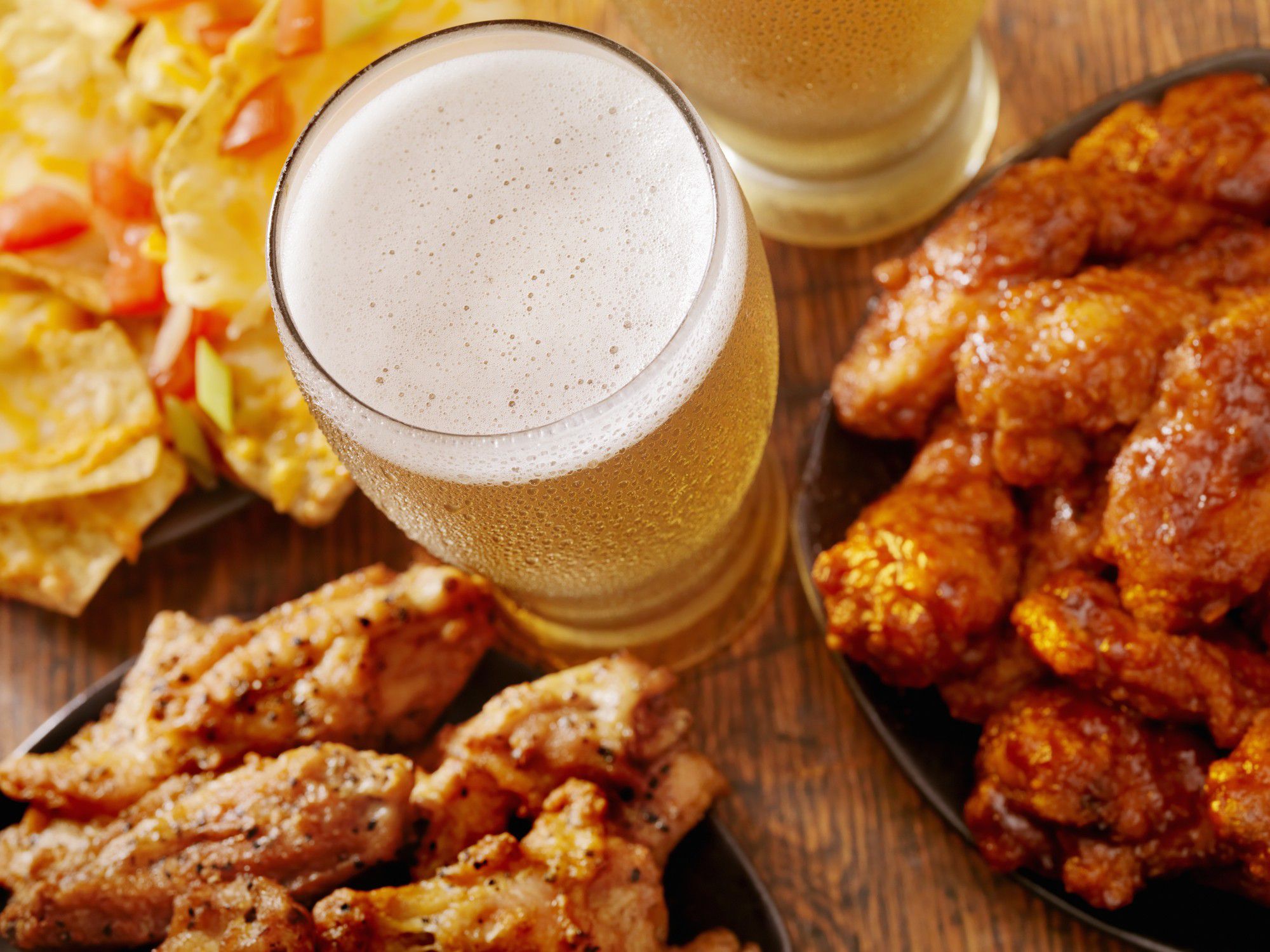 Hot wings, beer and nachos for foodies