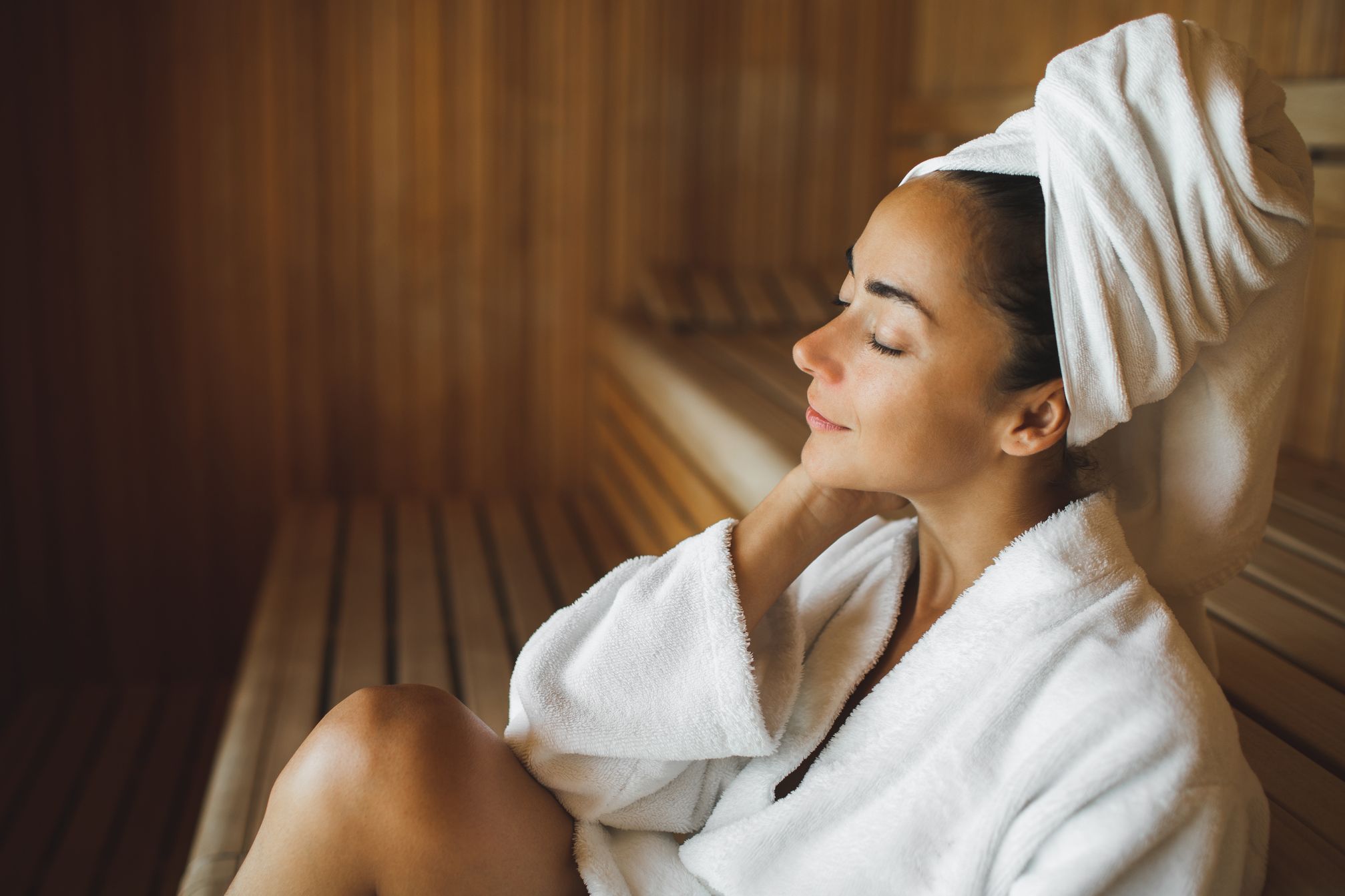 Woman in robe in the sauna.