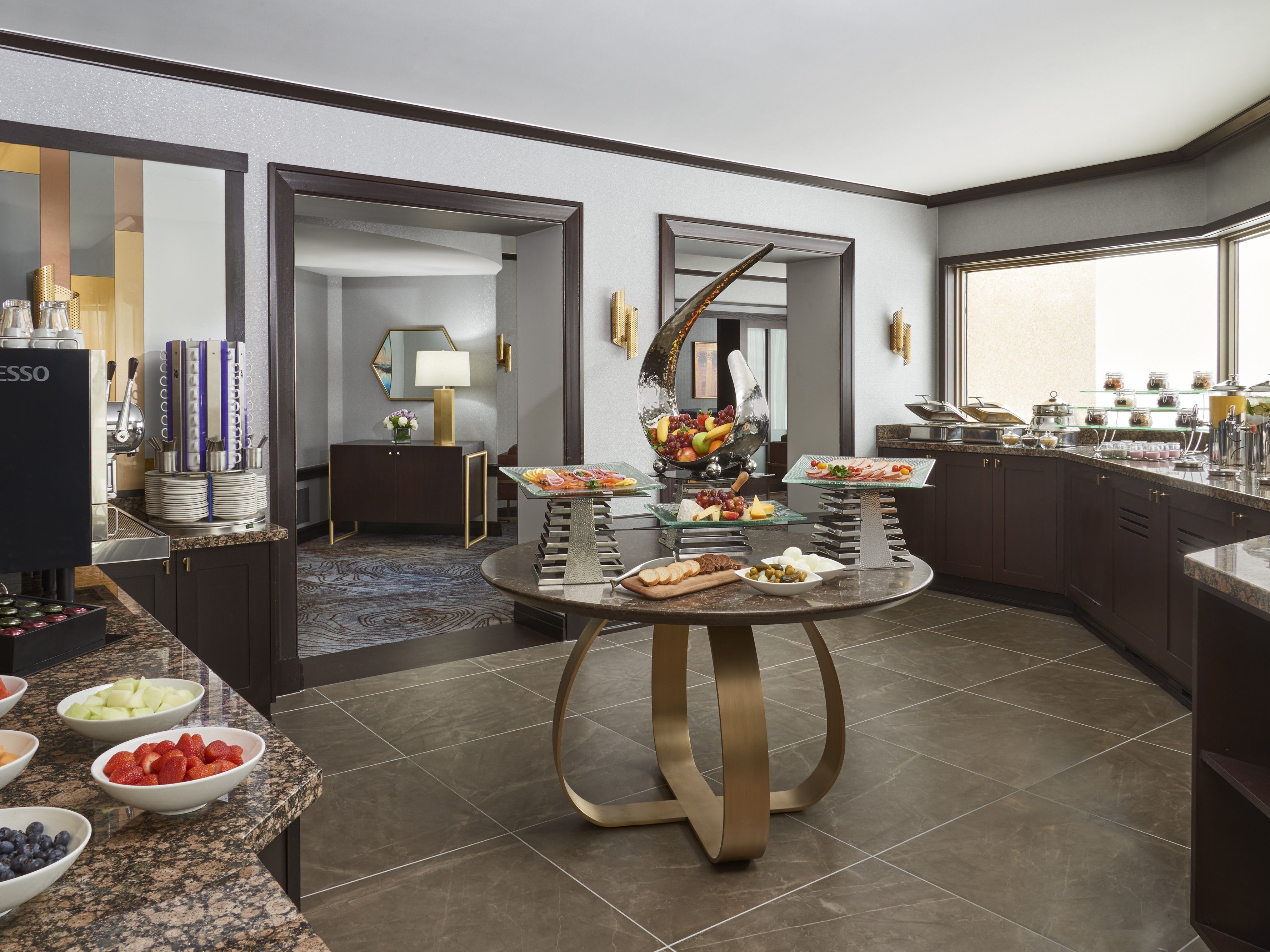 Club lounge breakfast buffet with fruit and coffee station
