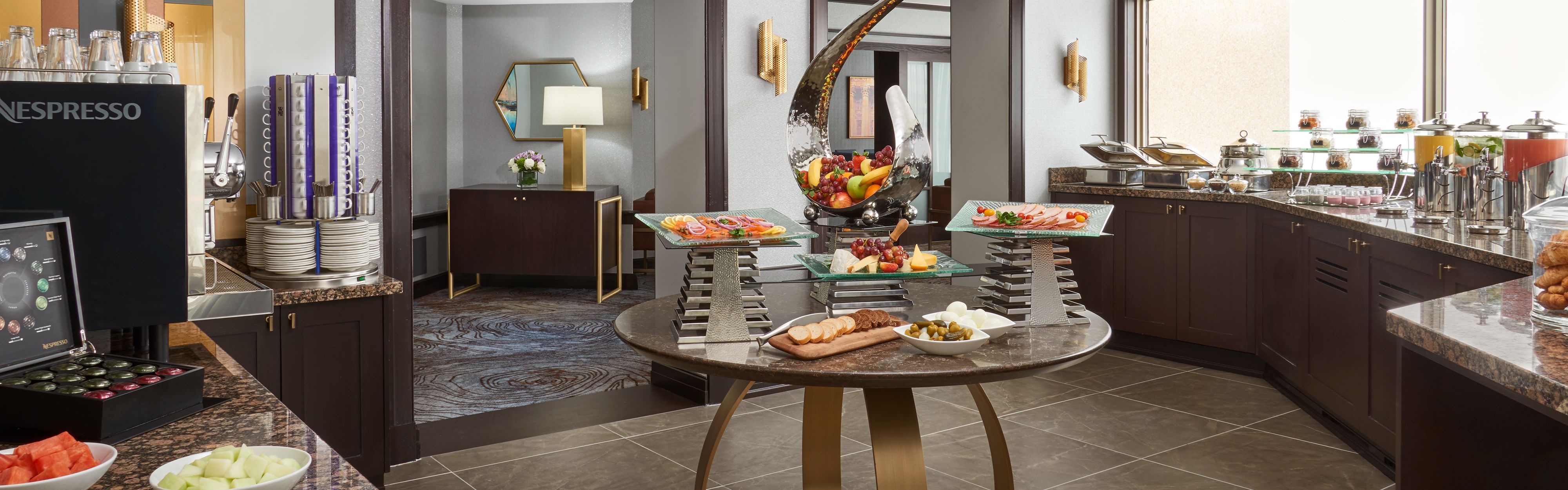 Buffet with an assortment of fruit, snakcs, coffee, and drinks at Club InterContinental.