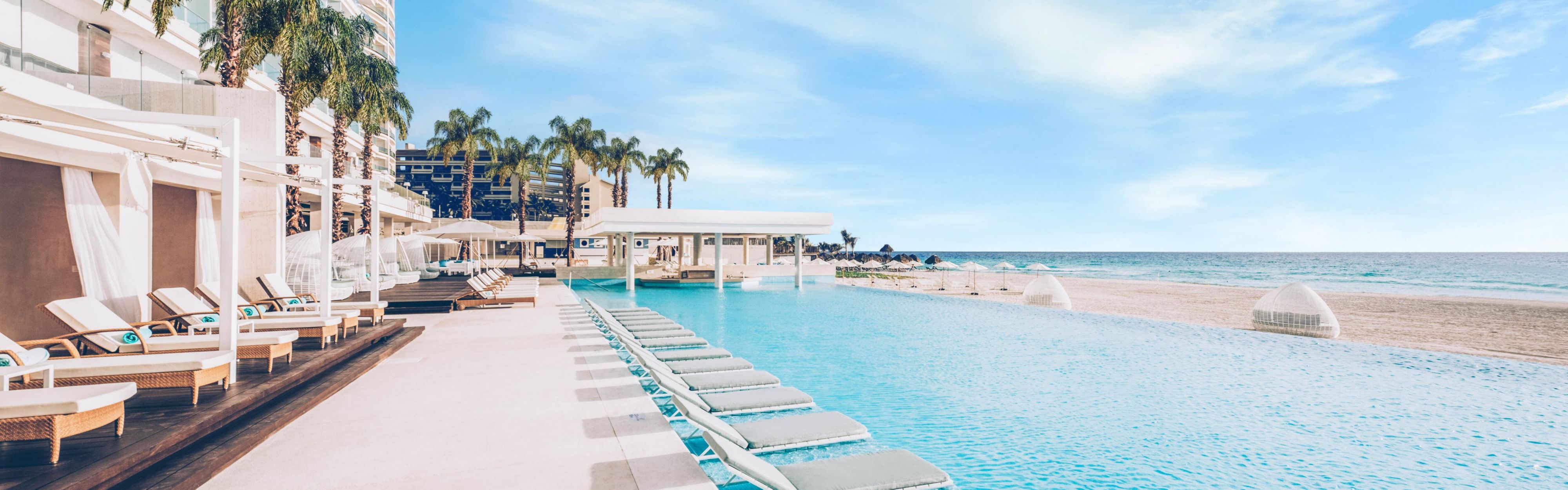 View of beach and pool at Iberostar Beachfront Resorts Coral Level Cancún